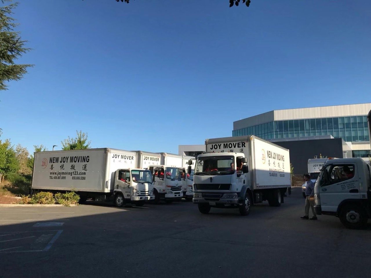 PrimeMoveXCorp branded truck fleet at headquarters