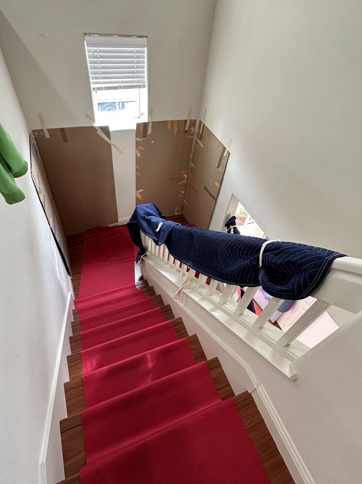 White-glove stair runner and wall protection installed during a residential move